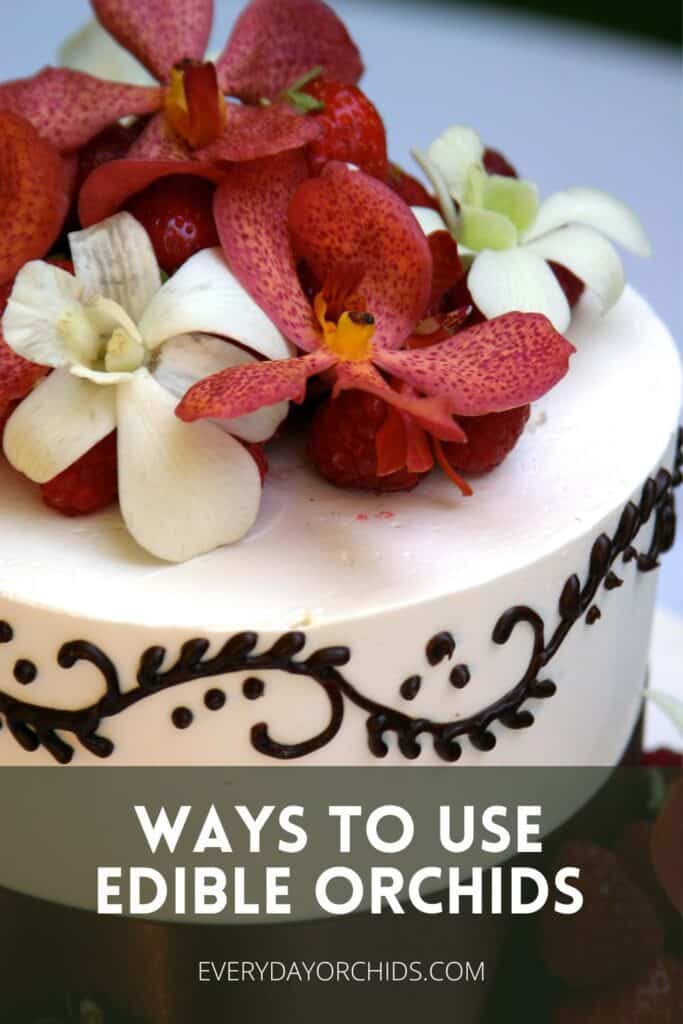 Red and white edible orchids on a cake